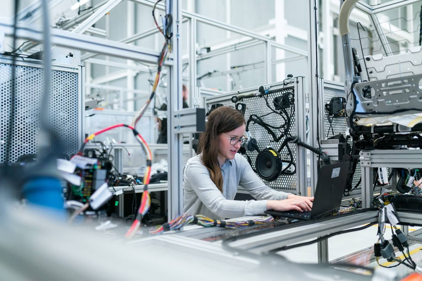 Manufacturing facility with engineers monitoring production systems